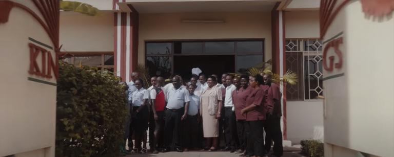 kcc staff stand at the front of the hotel smiling