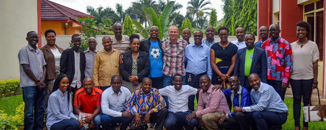 simon and all the glo partners pose for a photo