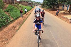 group cycling through a village