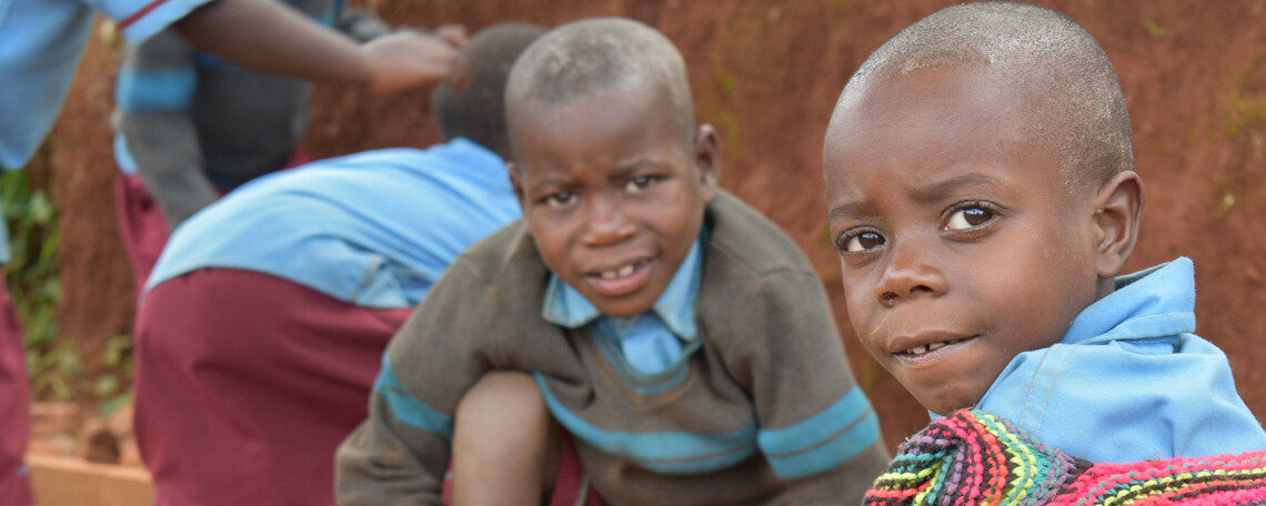 two schoolboys playing outside