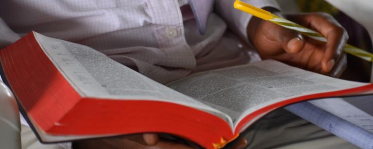 a student studies their bible