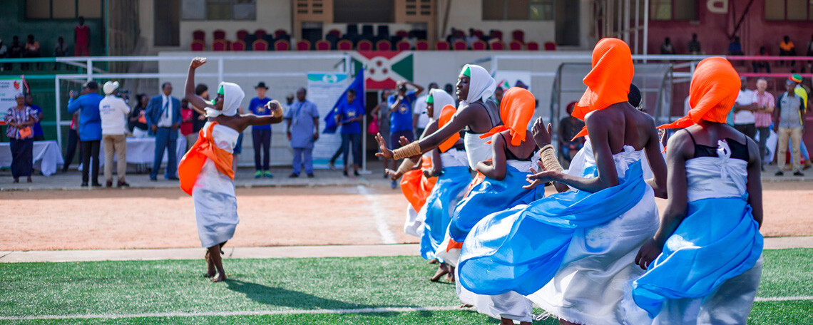 a group of women dancing in bright costumes